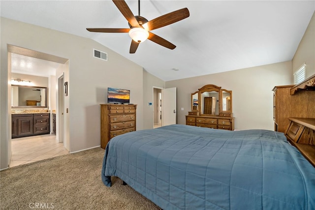 bedroom with visible vents, light tile patterned flooring, light carpet, a ceiling fan, and vaulted ceiling