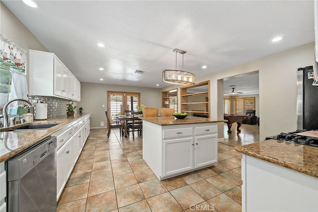 kitchen with stainless steel appliances, recessed lighting, a sink, and tasteful backsplash