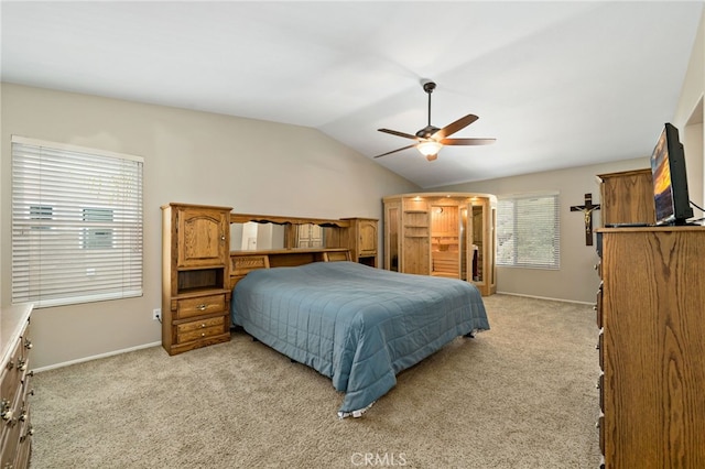 bedroom with baseboards, ceiling fan, lofted ceiling, and light colored carpet
