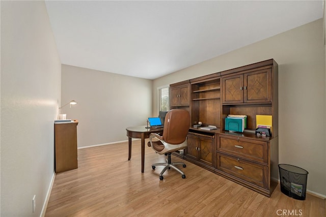 office with baseboards and light wood finished floors