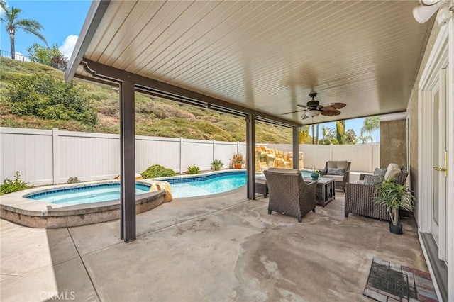 view of patio / terrace featuring ceiling fan, outdoor lounge area, a pool with connected hot tub, and a fenced backyard