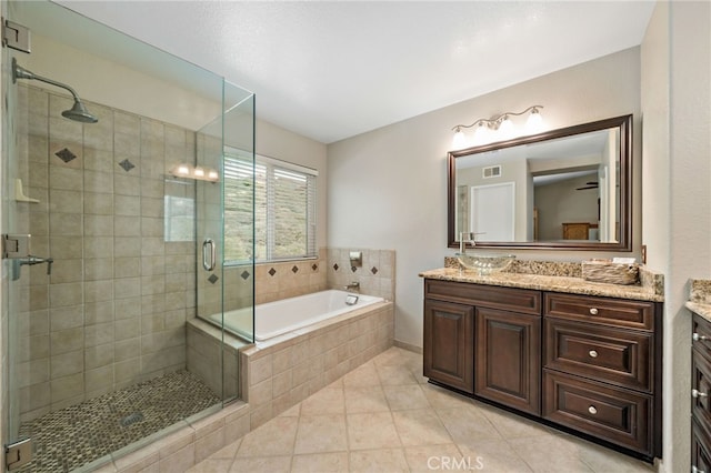 full bath with vanity, a garden tub, visible vents, tile patterned floors, and a shower stall