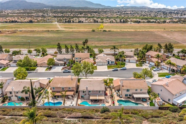 bird's eye view featuring a residential view and a mountain view