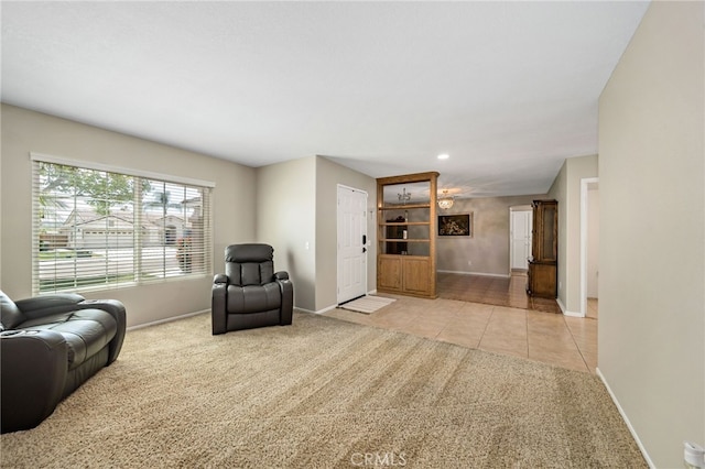 living area with light tile patterned floors, baseboards, light carpet, and recessed lighting