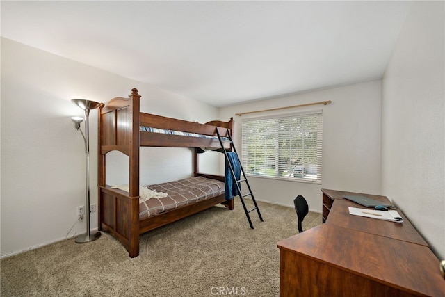 bedroom with carpet flooring and baseboards