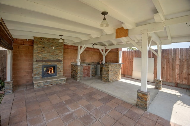 2030 N Keene Ave, Compton, CA 90059 - view of patio / terrace featuring an outdoor stone fireplace, fence, and area for grilling