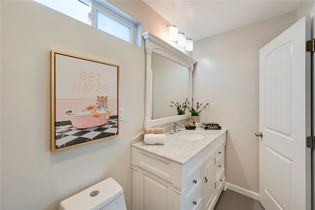2030 N Keene Ave, Compton, CA 90059 - bathroom featuring vanity, toilet, and baseboards