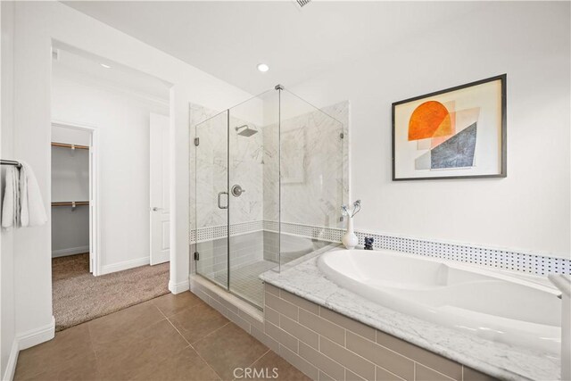 3040 E Coalinga Dr, Brea, CA 92821 - bathroom with baseboards, a stall shower, tile patterned flooring, a walk in closet, and a garden tub