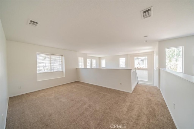 41044 Oak Creek Rd, Murrieta, CA 92562 - spare room with light carpet, healthy amount of natural light, and baseboards