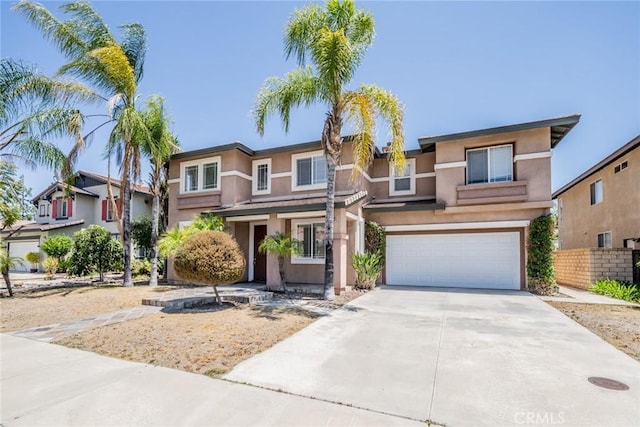 41044 Oak Creek Rd, Murrieta, CA 92562 - view of front of home featuring stucco siding, an attached garage, and concrete driveway