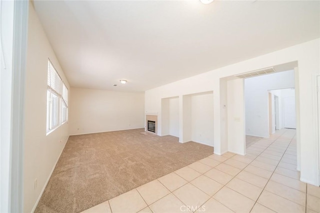 41044 Oak Creek Rd, Murrieta, CA 92562 - unfurnished living room featuring light colored carpet and a fireplace