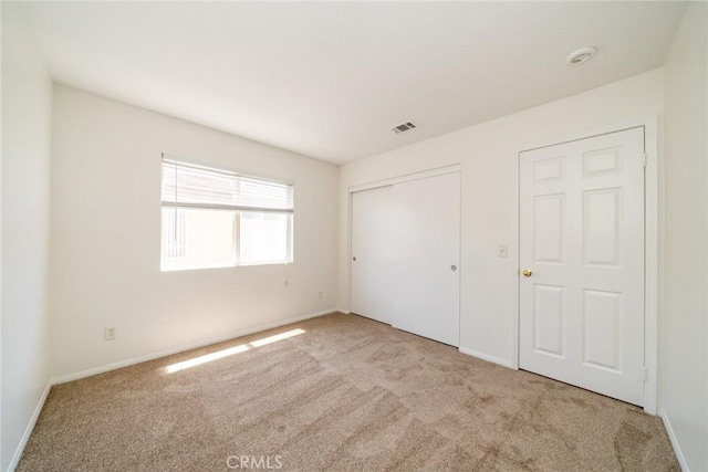41044 Oak Creek Rd, Murrieta, CA 92562 - unfurnished bedroom featuring carpet flooring, a closet, and baseboards