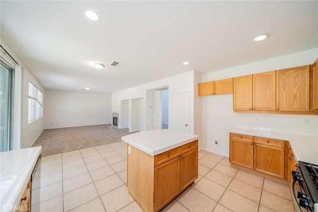 41044 Oak Creek Rd, Murrieta, CA 92562 - kitchen with light colored carpet, range, light countertops, open floor plan, and light tile patterned flooring