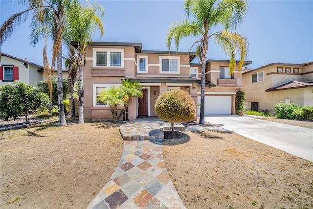 41044 Oak Creek Rd, Murrieta, CA 92562 - view of front of house featuring driveway, stucco siding, and a garage