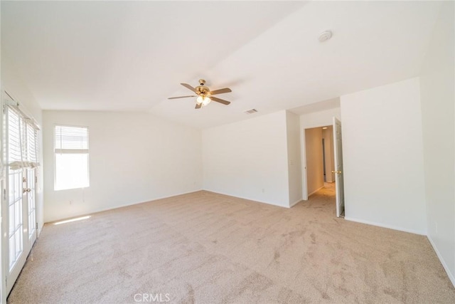 41044 Oak Creek Rd, Murrieta, CA 92562 - empty room with light carpet, a ceiling fan, lofted ceiling, baseboards, and a smoke detector