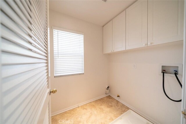 41044 Oak Creek Rd, Murrieta, CA 92562 - washroom with cabinet space, hookup for a washing machine, and baseboards