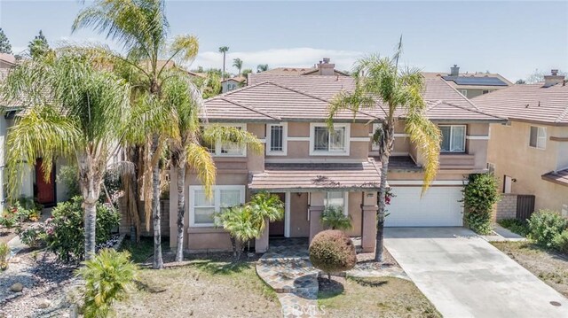 41044 Oak Creek Rd, Murrieta, CA 92562 - view of front of house with stucco siding, a garage, concrete driveway, and a tile roof