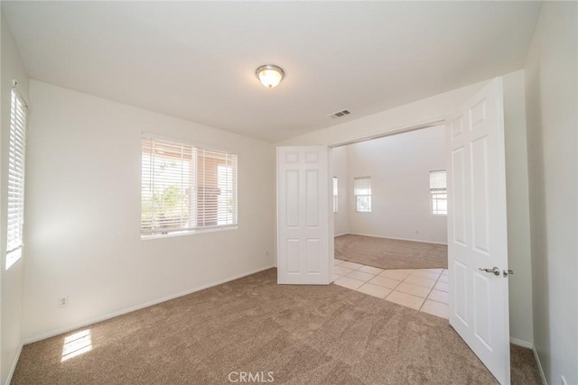 41044 Oak Creek Rd, Murrieta, CA 92562 - carpeted empty room featuring tile patterned flooring and baseboards