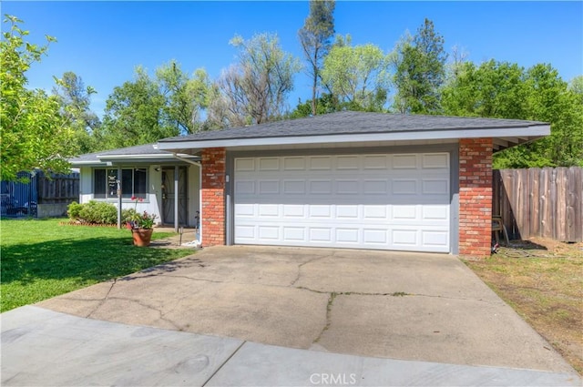 single story home featuring fence, a front yard, a garage, and brick siding