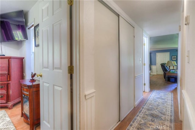 corridor featuring light wood-style floors