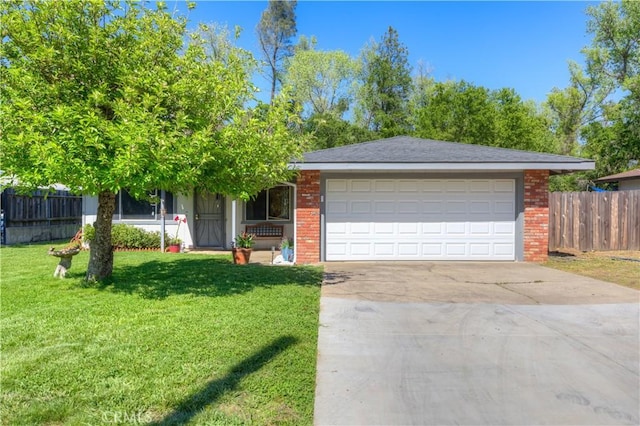 view of front of home featuring fence, an attached garage, a front lawn, brick siding, and concrete driveway