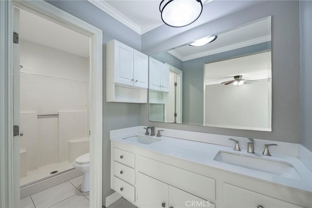 full bath featuring crown molding, a stall shower, toilet, ceiling fan, and double vanity
