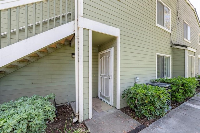 view of exterior entry featuring cooling unit