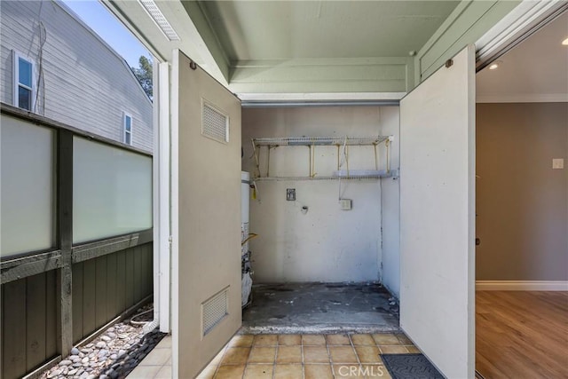 laundry area featuring gas water heater