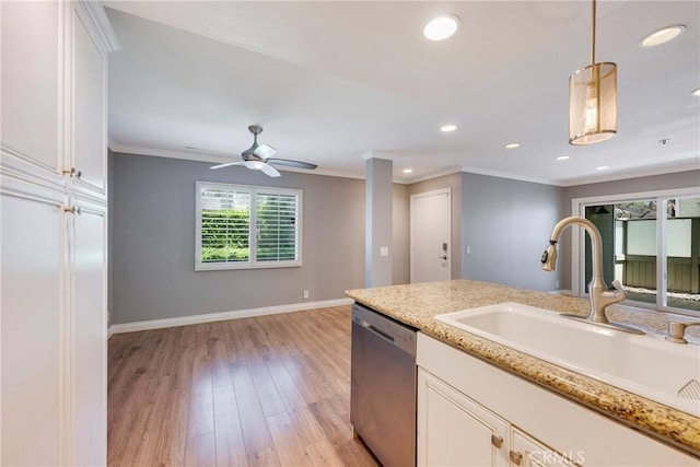 kitchen featuring dishwasher, a sink, white cabinetry, recessed lighting, and ornamental molding