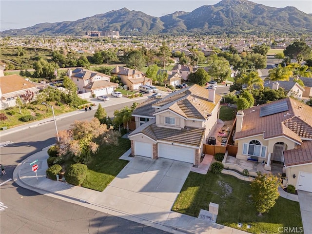 birds eye view of property with a mountain view and a residential view