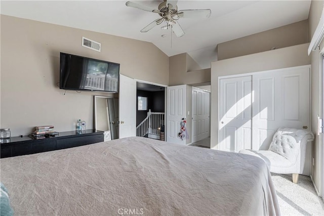 bedroom with carpet floors, a ceiling fan, visible vents, and vaulted ceiling