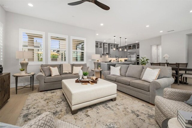 297 Sawbuck, Irvine, CA 92618 - living room with recessed lighting, light wood-style flooring, and ceiling fan