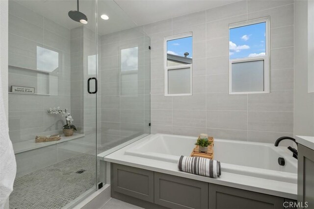 297 Sawbuck, Irvine, CA 92618 - full bathroom with a stall shower and a garden tub