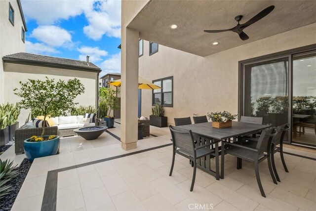 297 Sawbuck, Irvine, CA 92618 - view of patio / terrace with an outdoor living space with a fire pit, outdoor dining area, and ceiling fan