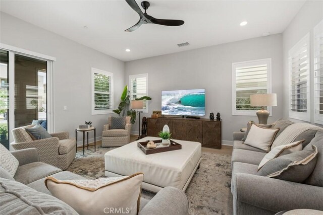 297 Sawbuck, Irvine, CA 92618 - living area with ceiling fan, recessed lighting, baseboards, and light wood-style flooring