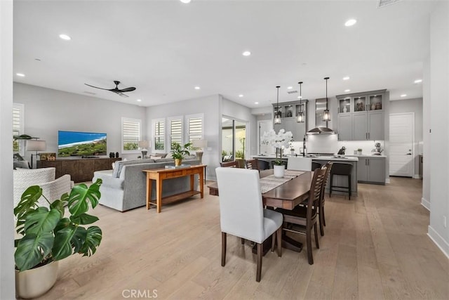297 Sawbuck, Irvine, CA 92618 - dining room with light wood-style flooring, recessed lighting, ceiling fan, and baseboards
