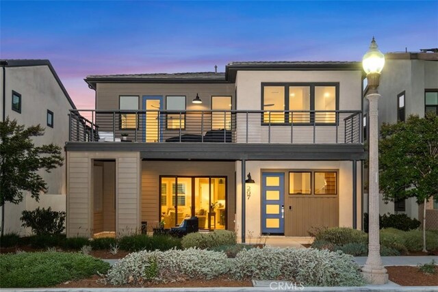 297 Sawbuck, Irvine, CA 92618 - back of property at dusk with a balcony