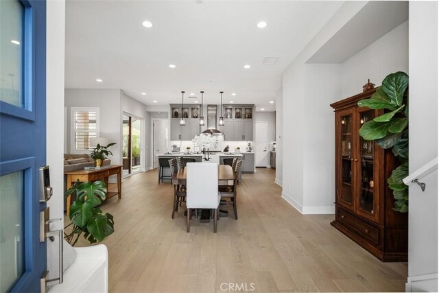 297 Sawbuck, Irvine, CA 92618 - dining space featuring light wood-style flooring, recessed lighting, and baseboards