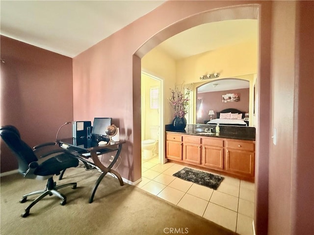 7163 Watcher St, Commerce, CA 90040 - ensuite bathroom with vanity, tile patterned flooring, toilet, and baseboards