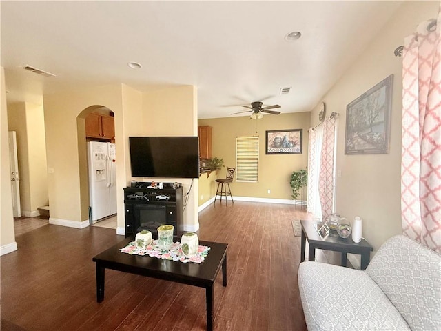 7163 Watcher St, Commerce, CA 90040 - living room with arched walkways, ceiling fan, wood finished floors, baseboards, and recessed lighting