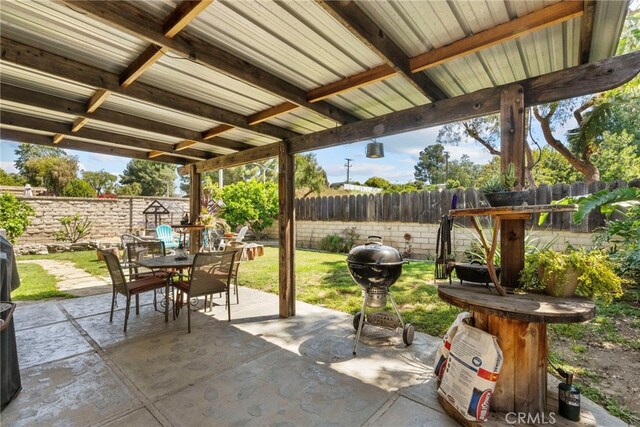 27736 Cherry Creek Dr, Valencia, CA 91354 - view of patio with grilling area, outdoor dining space, and a fenced backyard