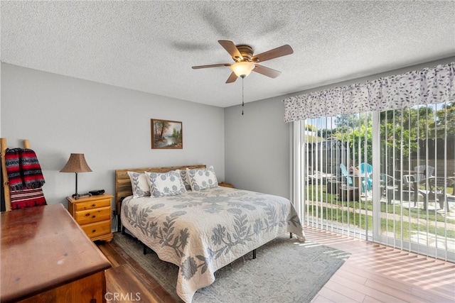 27736 Cherry Creek Dr, Valencia, CA 91354 - bedroom with a textured ceiling, access to exterior, and wood finished floors