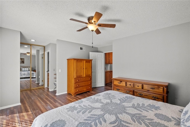 27736 Cherry Creek Dr, Valencia, CA 91354 - bedroom with a textured ceiling, visible vents, dark wood finished floors, and a closet