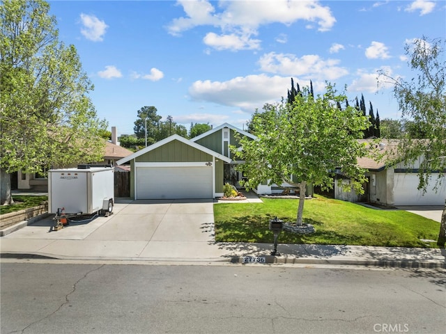 27736 Cherry Creek Dr, Valencia, CA 91354 - view of front of home featuring concrete driveway, an attached garage, and a front lawn