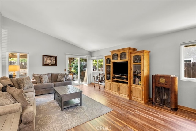 27736 Cherry Creek Dr, Valencia, CA 91354 - living room with light wood-style flooring, vaulted ceiling, and a healthy amount of sunlight