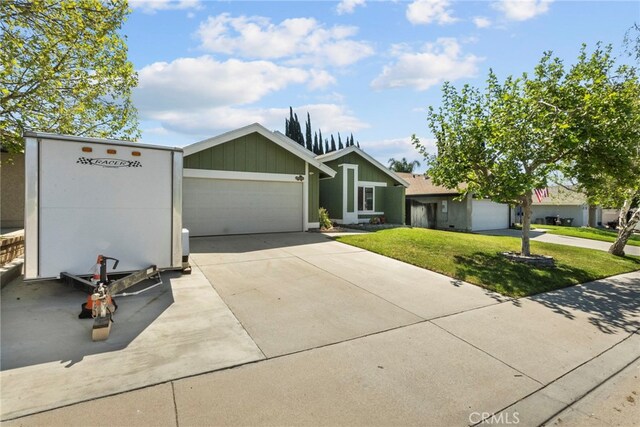 27736 Cherry Creek Dr, Valencia, CA 91354 - view of front of home featuring concrete driveway, a front lawn, and a garage