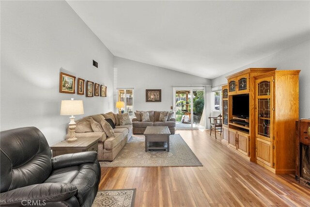 27736 Cherry Creek Dr, Valencia, CA 91354 - living area featuring light wood finished floors and vaulted ceiling