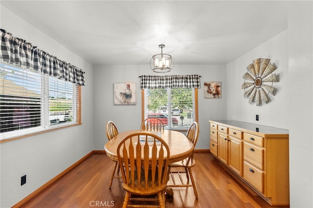 27736 Cherry Creek Dr, Valencia, CA 91354 - dining space featuring light wood-type flooring, baseboards, and a notable chandelier