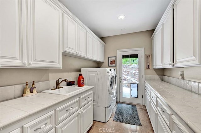 10302 Broadview Pl, North Tustin, CA 92705 - laundry room featuring cabinet space, independent washer and dryer, a sink, recessed lighting, and light tile patterned floors