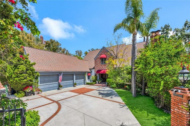 10302 Broadview Pl, North Tustin, CA 92705 - view of front of property featuring driveway, a tile roof, and a front lawn